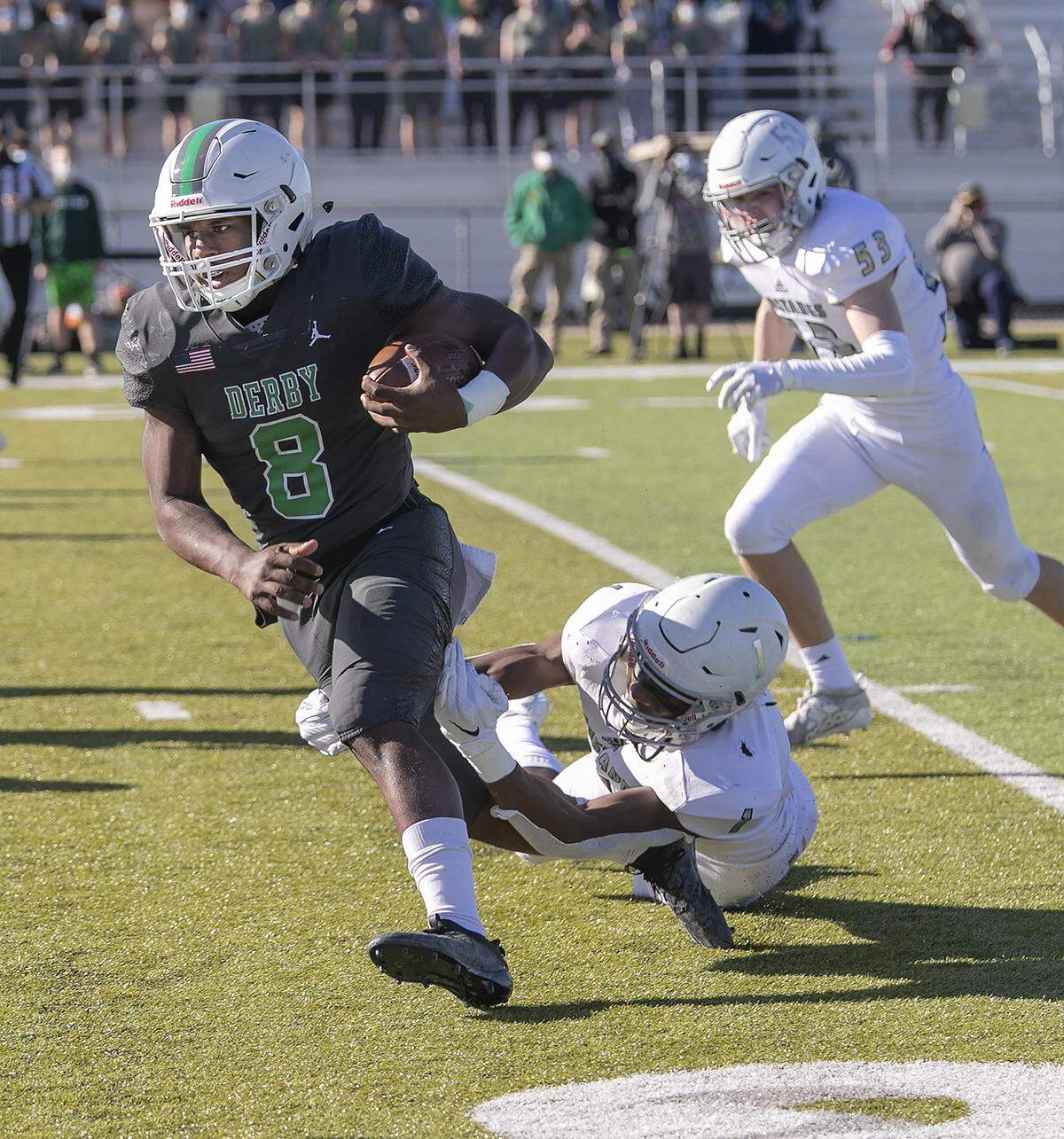 Derby quarterback Lem Wash avoids the Blue Valley North defense Saturday in the Kansas Class 6A state championship game at the College Boulevard Activity Center in Olathe.