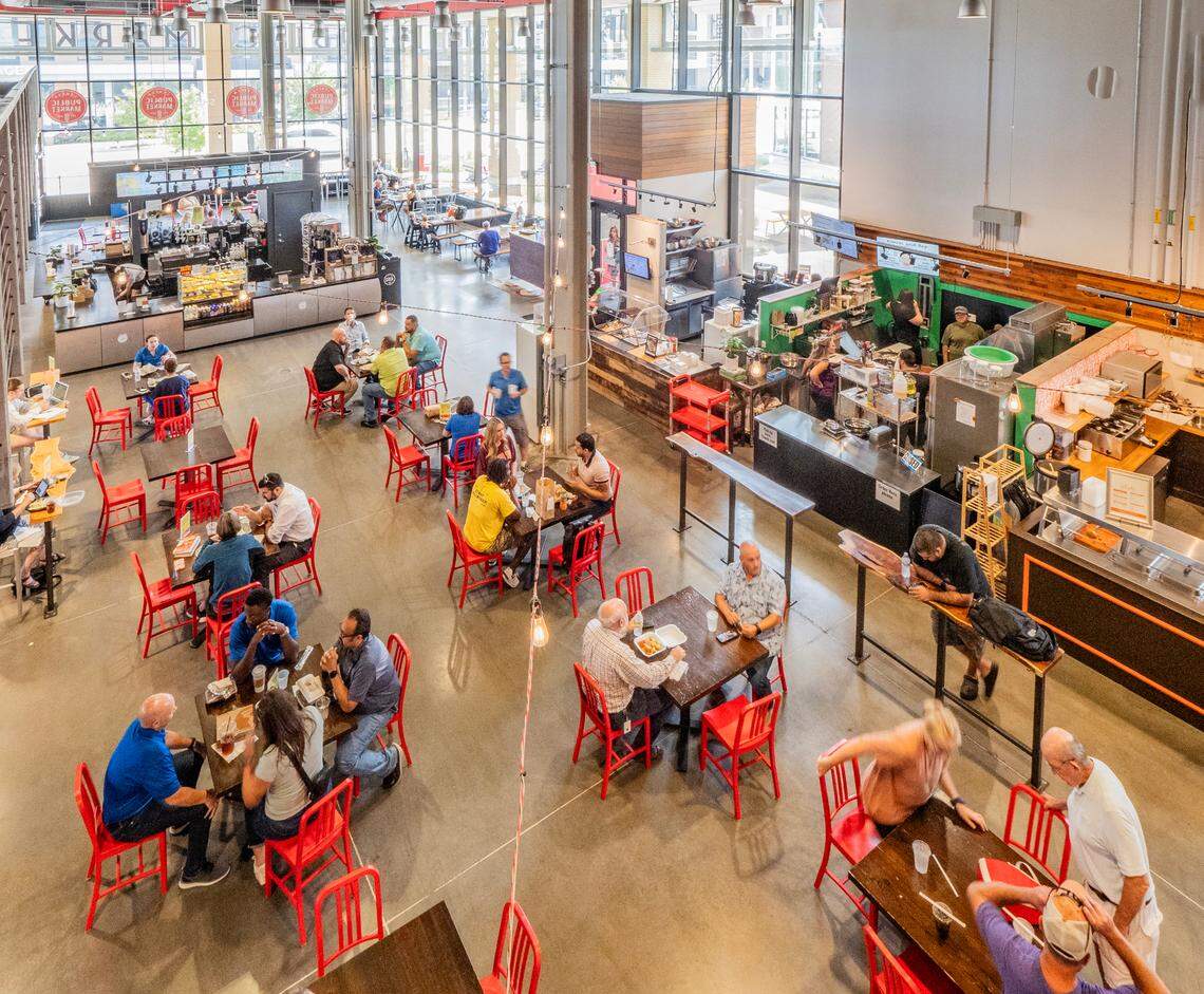 Families eat lunch at Lenexa’s Public Market, a food hall designed as a business incubator for restaurants and small, local businesses.