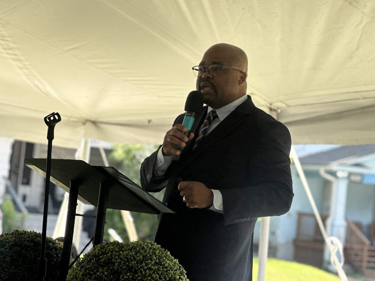 Marvin Lyman, CEO of real estate development firm Sankofa EDG, speaks at the ceremony before the groundbreaking.