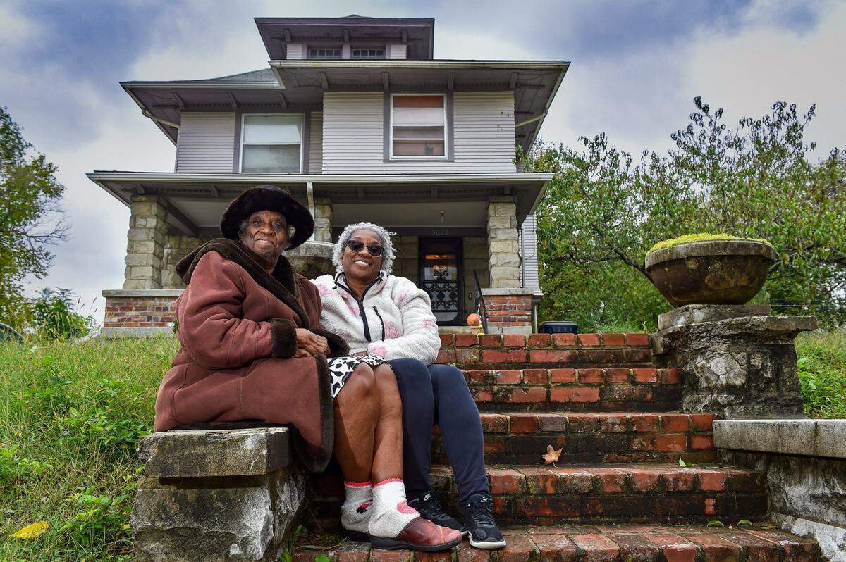 Eartha Ersery, left, sits with her daughter, Marion Halim, who takes the calls when people try to buy Ersery’s East Side house.