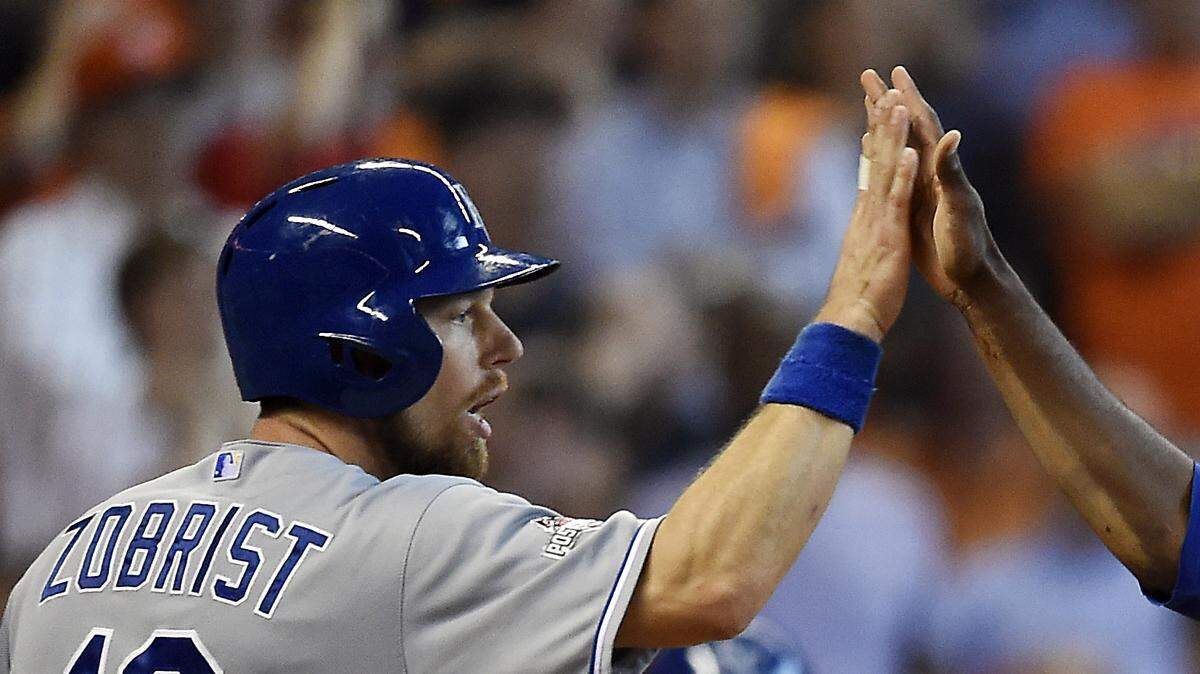 Kansas City Royals second baseman Ben Zobrist and center fielder Lorenzo Cain celebrate after they both scored on a hit by designated hitter Kendrys Morales in the eighth inning during Monday's ALDS baseball game on October 12, 2015 at Minute Maid Park in Houston, Tex.