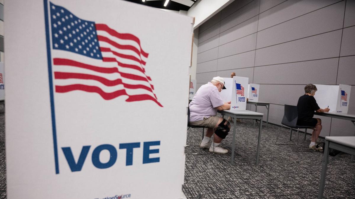 Voters cast ballots for the primary election at the Midwest Genealogy Center on Tuesday, Aug. 6, 2024, in Independence.