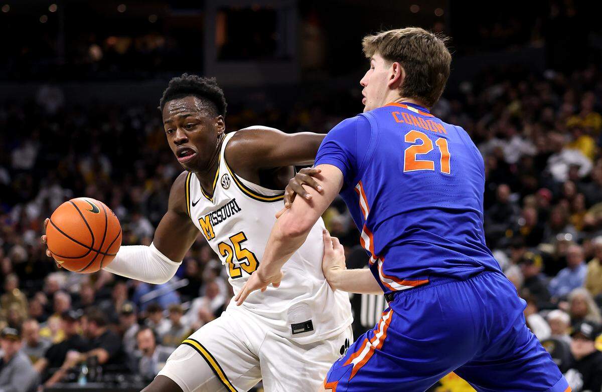 Mark Mitchell #25 of the Missouri Tigers drives past Alex Condon #21 of the Florida Gators during the game at Mizzou Arena on January 3, 2026 in Columbia.