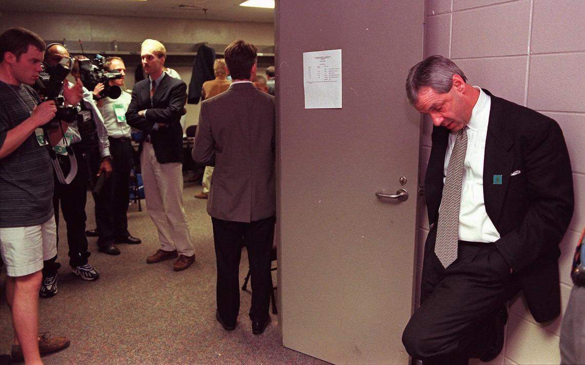 Kansas coach Roy Williams takes a moment before meeting with the media after his Jayhawks lost to Arizona 85-82 in their NCAA Southeast regional semifinal game Friday, March 21, 1997, in Birmingham, Ala. The loss was devastating, ruining what was supposed to be their magical season. When the top-ranked Kansas Jayhawks were knocked out of the NCAA tournament by eventual champ Arizona last season, coach Roy Williams looked inward and to others for strength. (AP Photo/TOPEKA CAPITAL JOURNAL, David Eulitt)