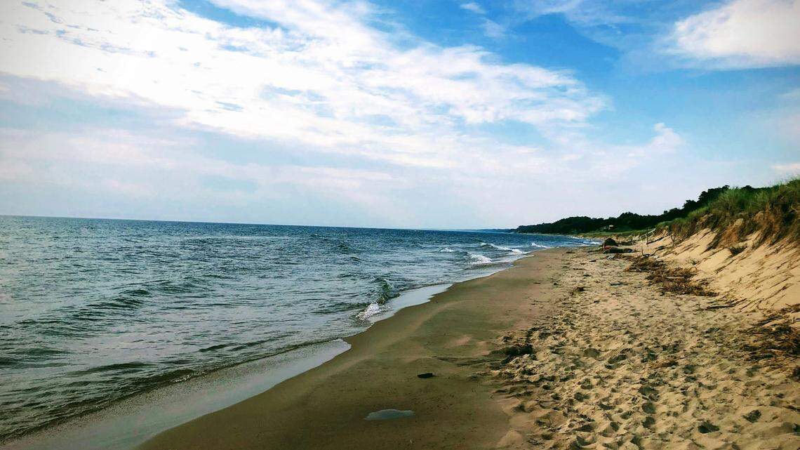 A boat capsized in Lake Michigan near a Chicago suburb, separating two boaters, officials said. One swam to shore while the other was stranded for hours