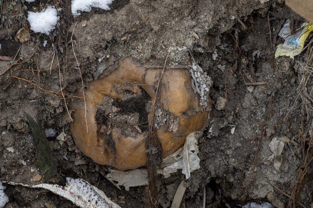 Debris is seen inside a sinkhole in the backyard of Cassandra Krul's home on Monday, Feb. 2, 2026, in Independence.