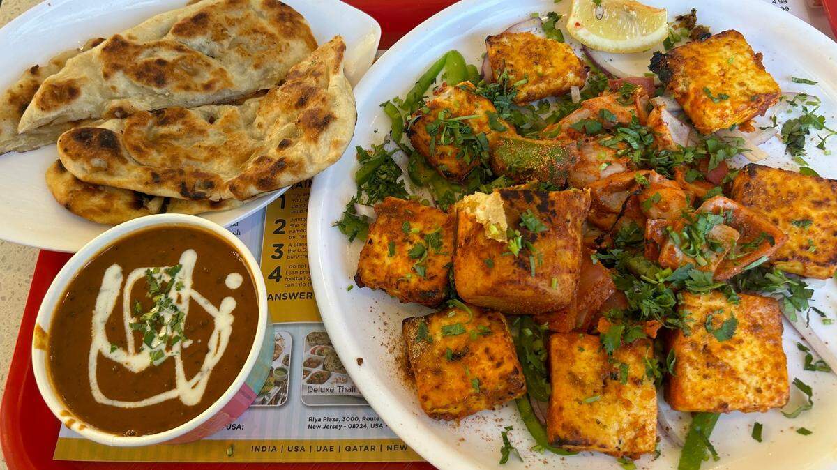 Bikanervala’s tandoori platter includes paneer, naan and dal makhani (soup).