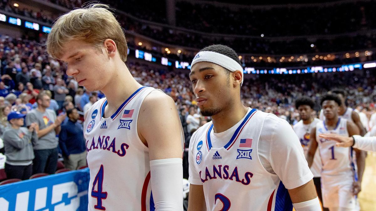 Kansas guards Gradey Dick (4) and Dajuan Harris Jr. (3) walk off the court after losing 72-71 to Arkansas in a second-round college basketball game in the NCAA Tournament Saturday, March 18, 2023, in Des Moines, Iowa.