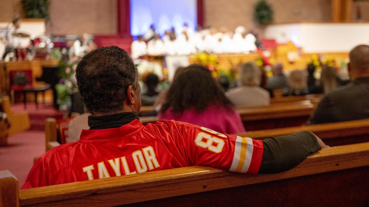 A man wears a Chiefs Otis Taylor jersey during a funeral for the wide receiver Wednesday, March 22, 2023, at Friendship Baptist Church in Kansas City. Taylor played from 1965-75 and was inducted into the Chiefs Hall of Fame in 1982.