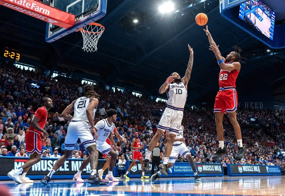 Kansas Jayhawks guard Darryn Peterson (22) gets off a floater as Kansas State Wildcats guard David Castillo (10) defends in the second half at Allen Fieldhouse on Saturday, March 7, 2026, in Lawrence, Kansas.