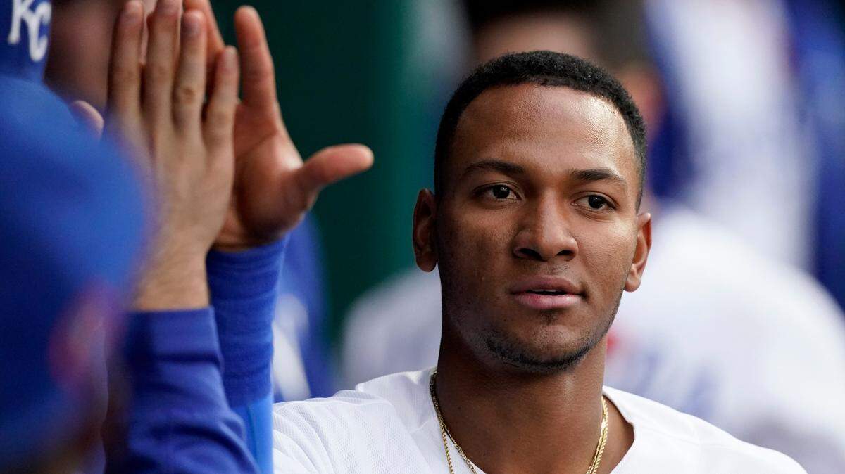 Kansas City Royals’ Edward Olivares celebrates in the dugout after scoring on a double by Kansas City Royals’ Hunter Dozier during the second inning of a baseball game against the Pittsburgh Pirates Monday, May 31, 2021, in Kansas City, Mo. (AP Photo/Charlie Riedel)