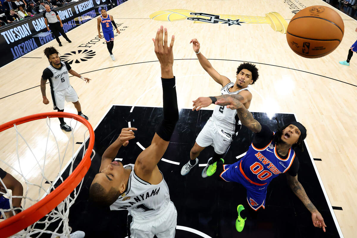 Jordan Clarkson #00 of the New York Knicks shoots against Victor Wembanyama #1 and Dylan Harper #2 of the San Antonio Spurs during the second half in Game 5 of the 2026 NBA Finals at Frost Bank Center on June 13, 2026 in San Antonio, Texas.
