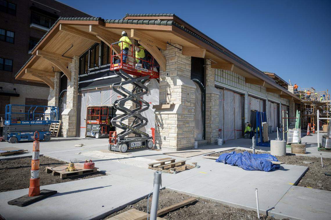 Work continues on the new Overland Park Farmers Market pavilion and the Clock Tower Landing, a $34 million project underway in downtown Overland Park on Tuesday, April 21, 2026. The first farmers market is set to open at 7 a.m. Saturday, June 6, 2026 in this pavilion. 