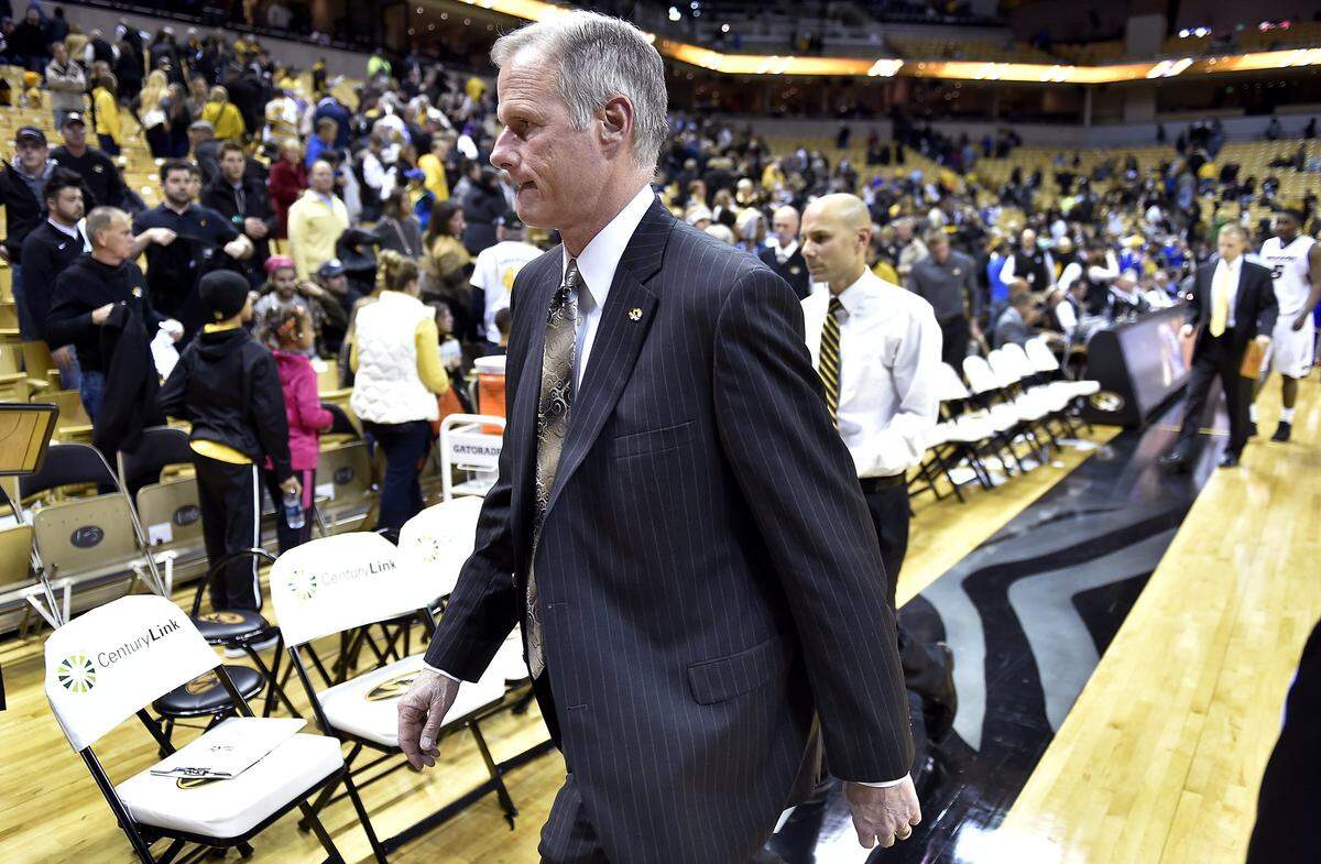 Missouri Tigers men’s basketball coach Kim Anderson and assistant Brad Loos walk off the court after a season-opening loss to UMKC at Mizzou Arena.