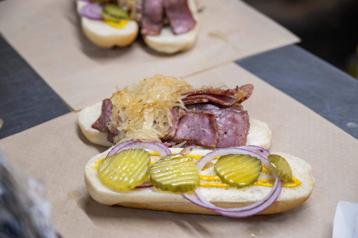 A kielbasa sandwich with pickles, onion, mayo, and mustard at Peter May's House of Kielbasa, on Tuesday, Oct. 7, 2025. The hole-in-a-wall restaurant has been around since the 1940s and used to be a neighborhood grocery store.