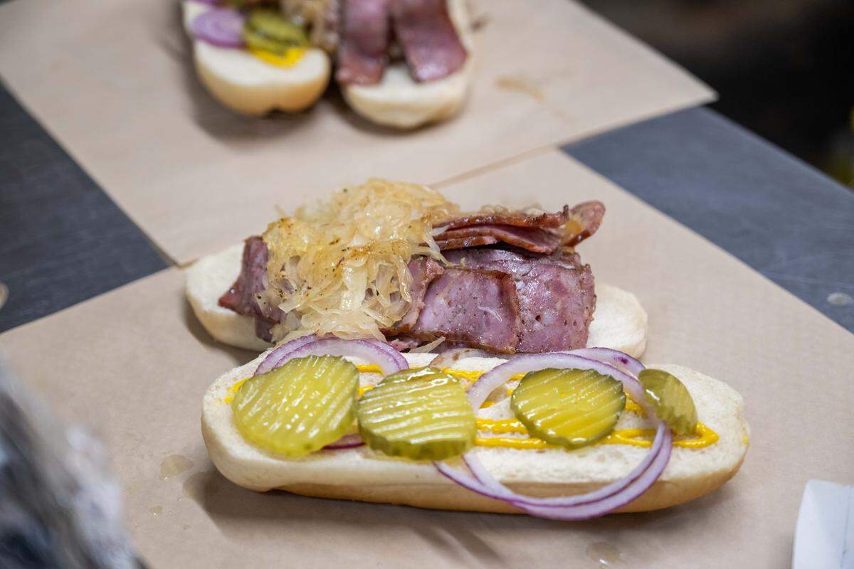 A kielbasa sandwich with pickles, onion, mayo, and mustard at Peter May's House of Kielbasa.