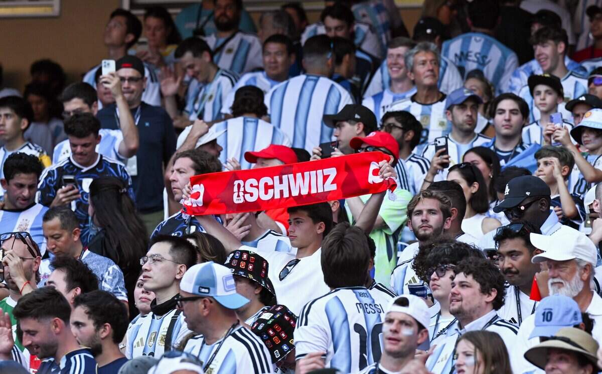 A lone Swiss fan shows their team scarf in a sea of Argentina fans before the Argentina vs. Switzerland 2026 World Cup Quarterfinal football match at Kansas City (Arrowhead) Stadium in Kansas City on Saturday, July 11, 2026.