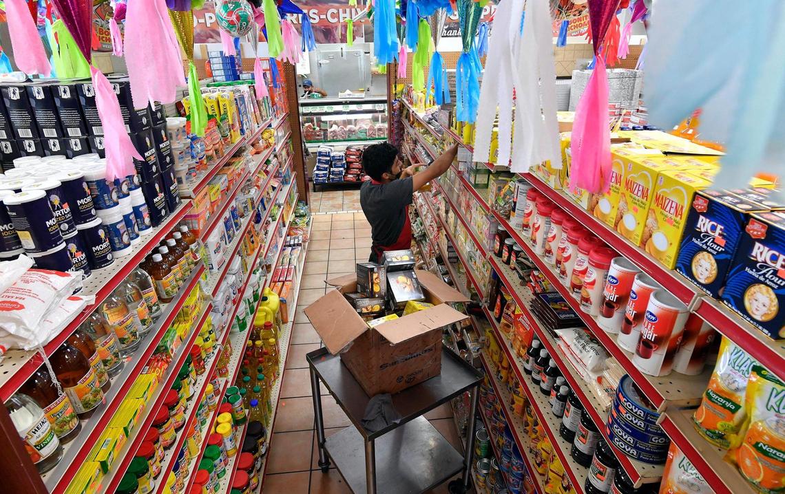 Fernando Rivera stocks shelves at Bonito Michoacán, one of several Latin-American owned businesses in the Kansas City metro area. Guillermo Pineda opened the grocery store and restaurant on Minnesota Avenue in in Kansas City, Kansas, in 2007. The staff speaks Spanish, and the store is a vibrant reminder of Mexico and Latin America. The products are imported from Latin-America and a majority of the patrons who shop there are Hispanic.