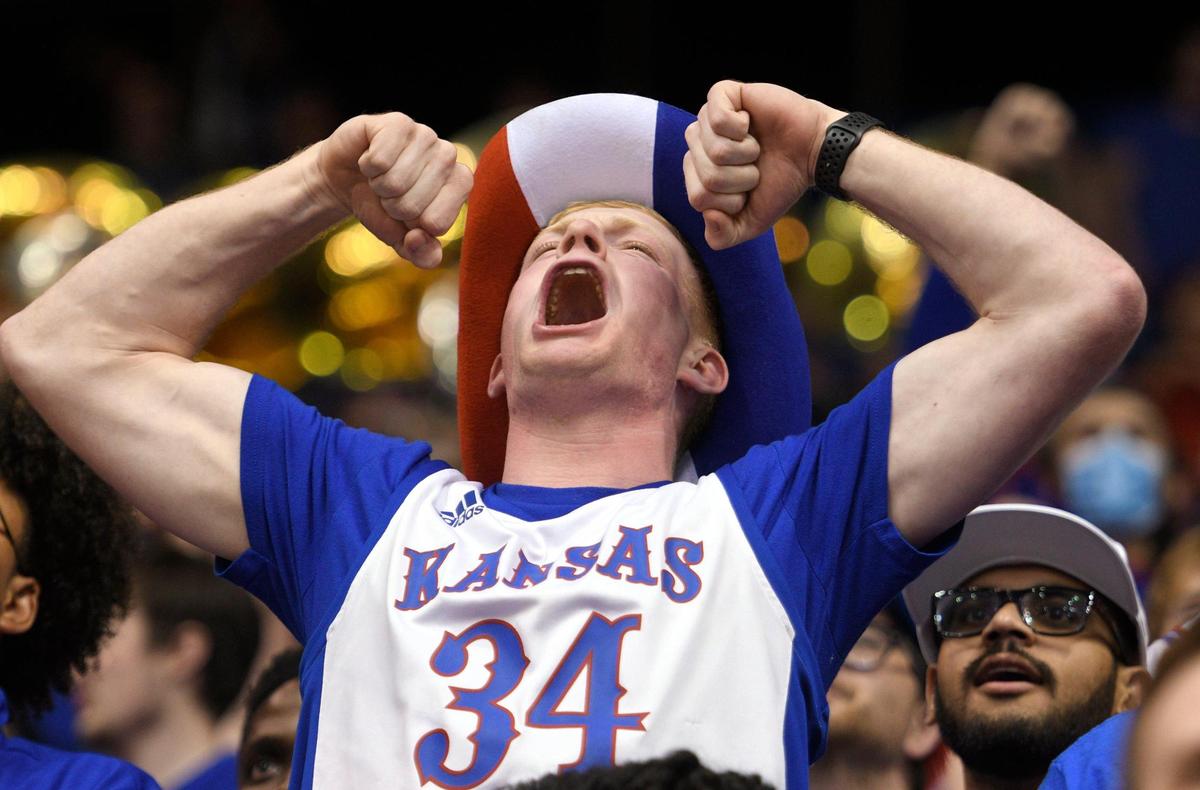 Jayhawk fans including student Blake Hatcher celebrated a historic comeback victory in Allen Fieldhouse as Kansas came back from a 15 point deficit to defeat North Carolina for the NCAA National Championship in New Orleans on Monday, April 4, 2022.