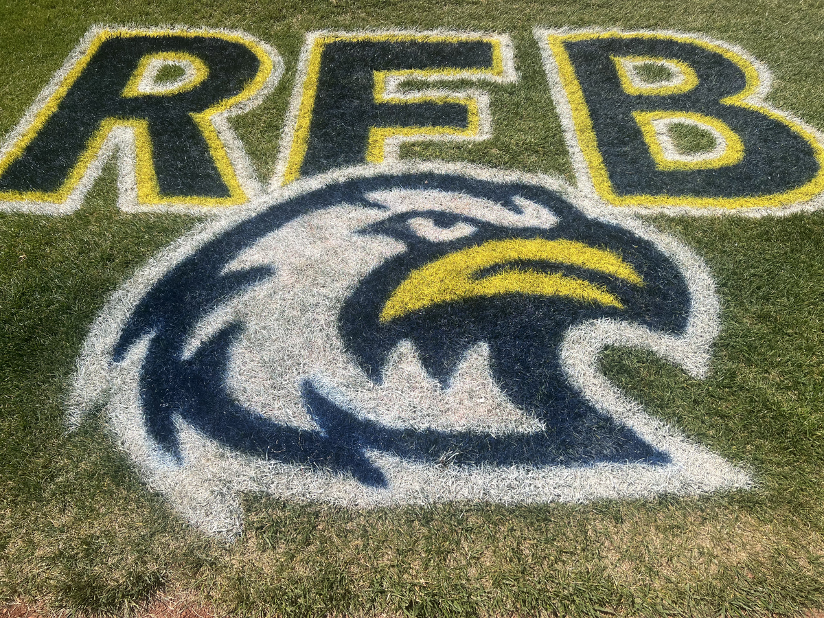 Liberty North baseball’s Ready For Battle logo behind home plate. It’s one of many places the slogan is located at the baseball field.
