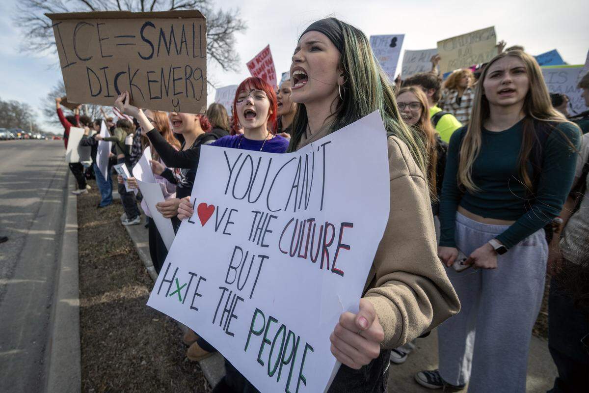 Students at Shawnee Mission North High School stood in protest of ICE and the Trump administration's policies along Johnson Drive on Wednesday, February 11, 2026, in Overland Park.