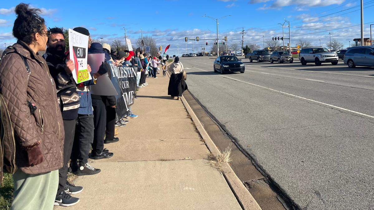 Students from the University of Kansas and University of Missouri-Kansas City rally in Overland Park Saturday afternoon, demanding a ceasefire in Gaza.