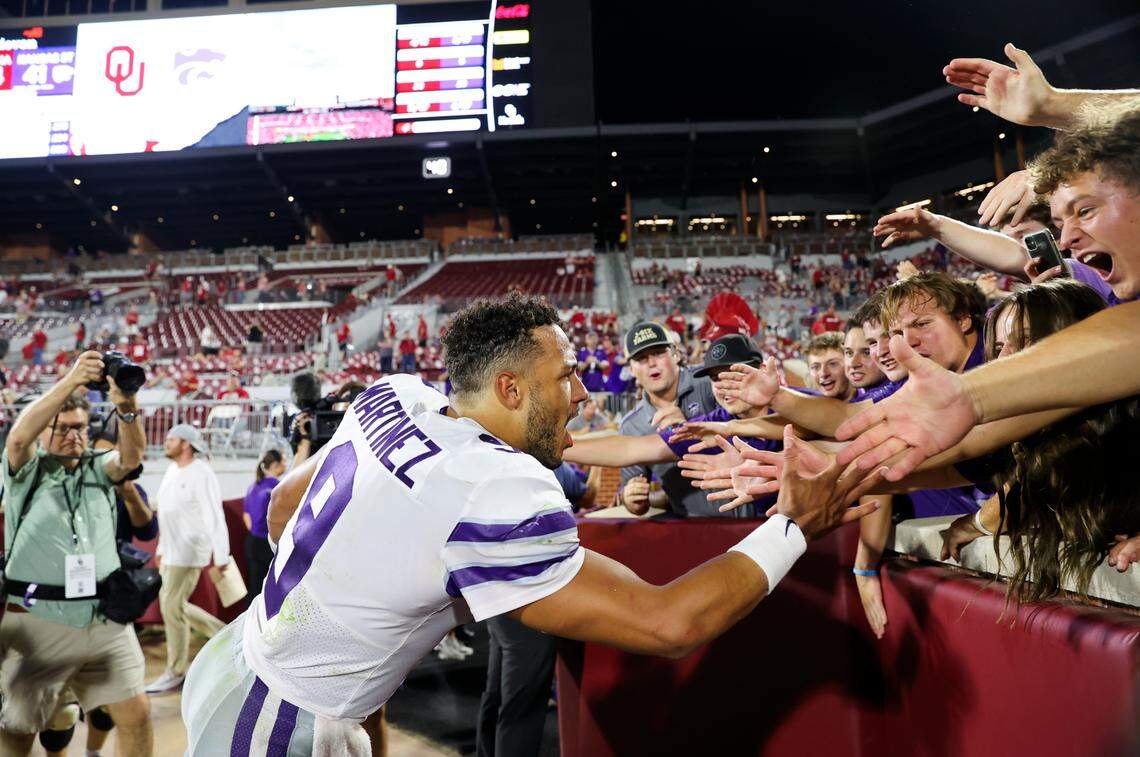 Kansas State Wildcats quarterback Adrian Martinez (9) celebrates with fans after the game against the Oklahoma Sooners at Gaylord Family-Oklahoma Memorial Stadium on Sept. 24, 2022.
