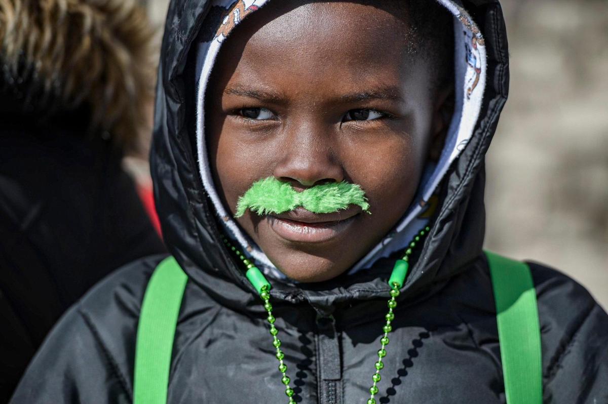 Romell Law sported a green mustache Friday, March 17, 2023, during the annual St. Patrick’s Day parade in Kansas City.