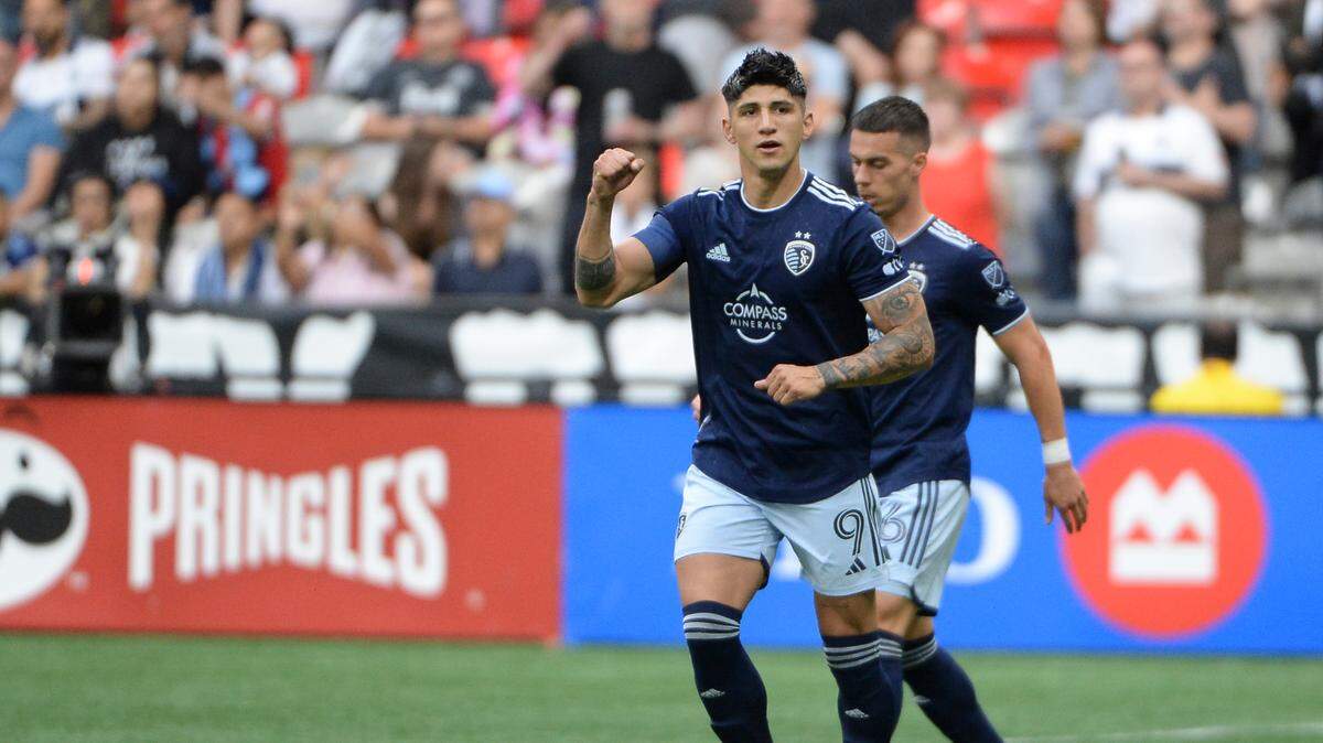 Sporting Kansas City forward Alan Pulido (9) celebrates his goal against Vancouver Whitecaps FC goalkeeper Yohei Takaoka (18) during the first half at BC Place in Vancouver, Canada, on June 3, 2023.
