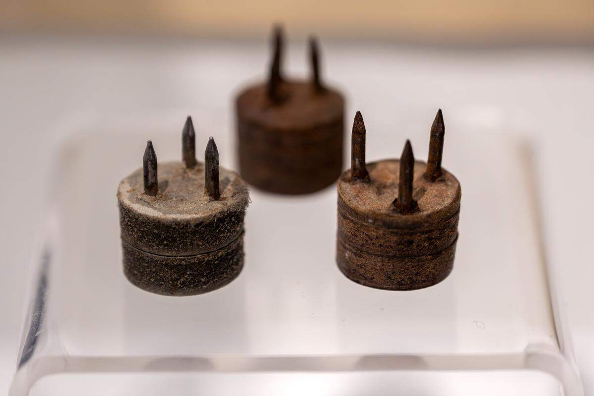 Removable studs used to turn work boots into football boots are displayed in the new exhibition “The Beautiful Game,” highlighting the role of soccer during World War I, at the National WWI Museum and Memorial on Wednesday, April 1, 2026, in Kansas City.