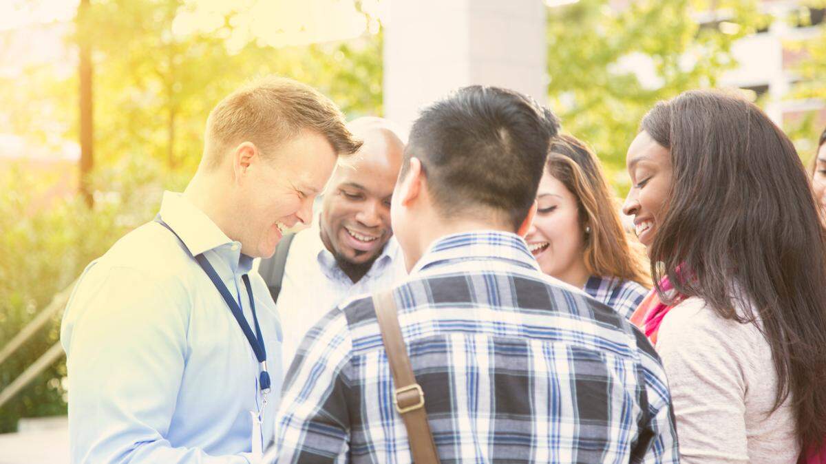 A college recruiter shows a campus to potential students. Think carefully about where you want to get your education before taking out loans. A state school or community college could be a great choice.