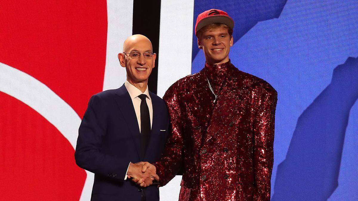 Gradey Dick (Kansas) with NBA commissioner Adam Silver after being selected 13th overall by the Toronto Raptors in the first round of the 2023 NBA Draft at Barclays Arena in Brooklyn on June 22, 2023.