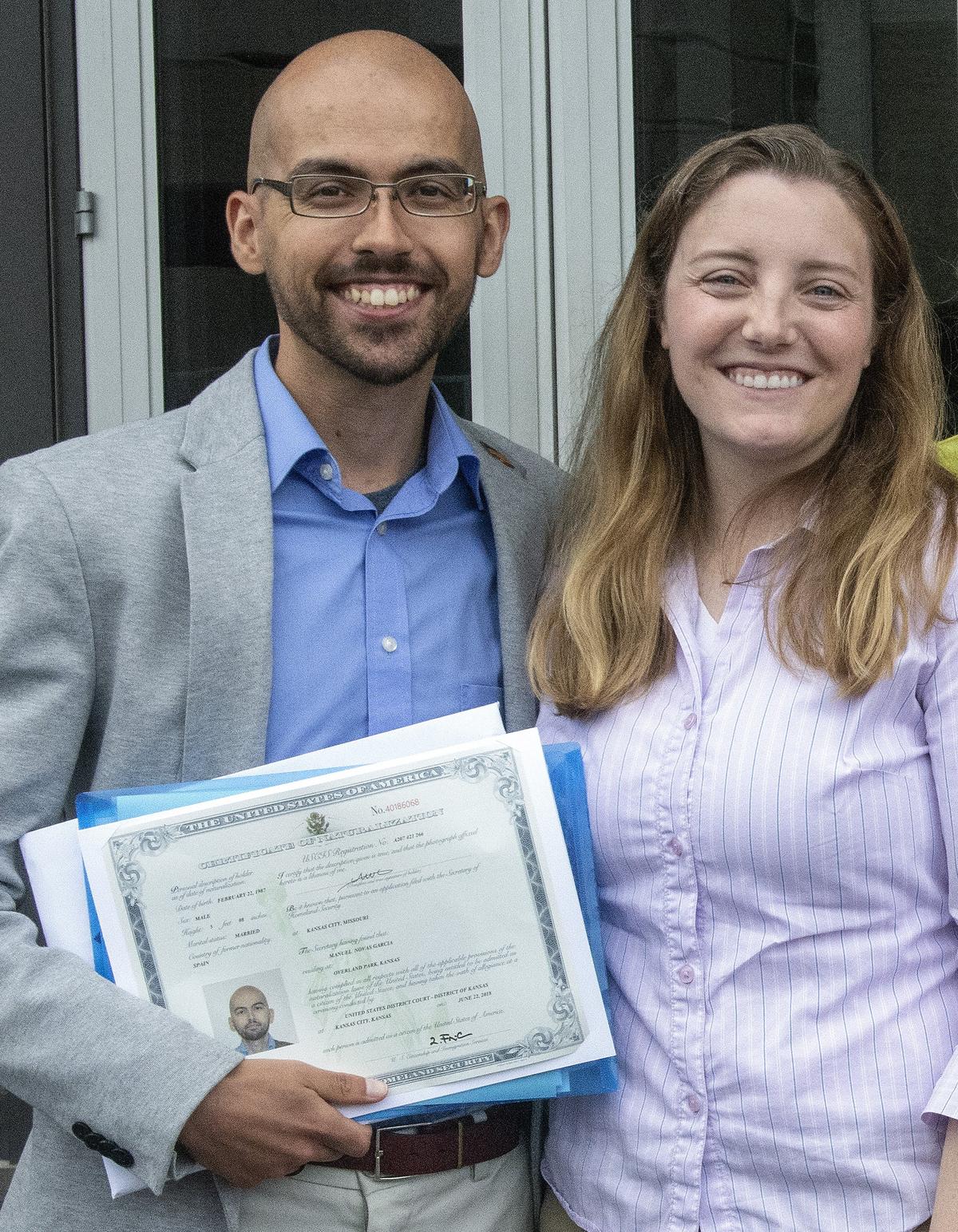 Manuel Novas-Garcia, who is from Spain, posed with his wife after Friday's naturalization ceremony at the Robert J. Dole Federal Courthouse in Kansas City, Kan.