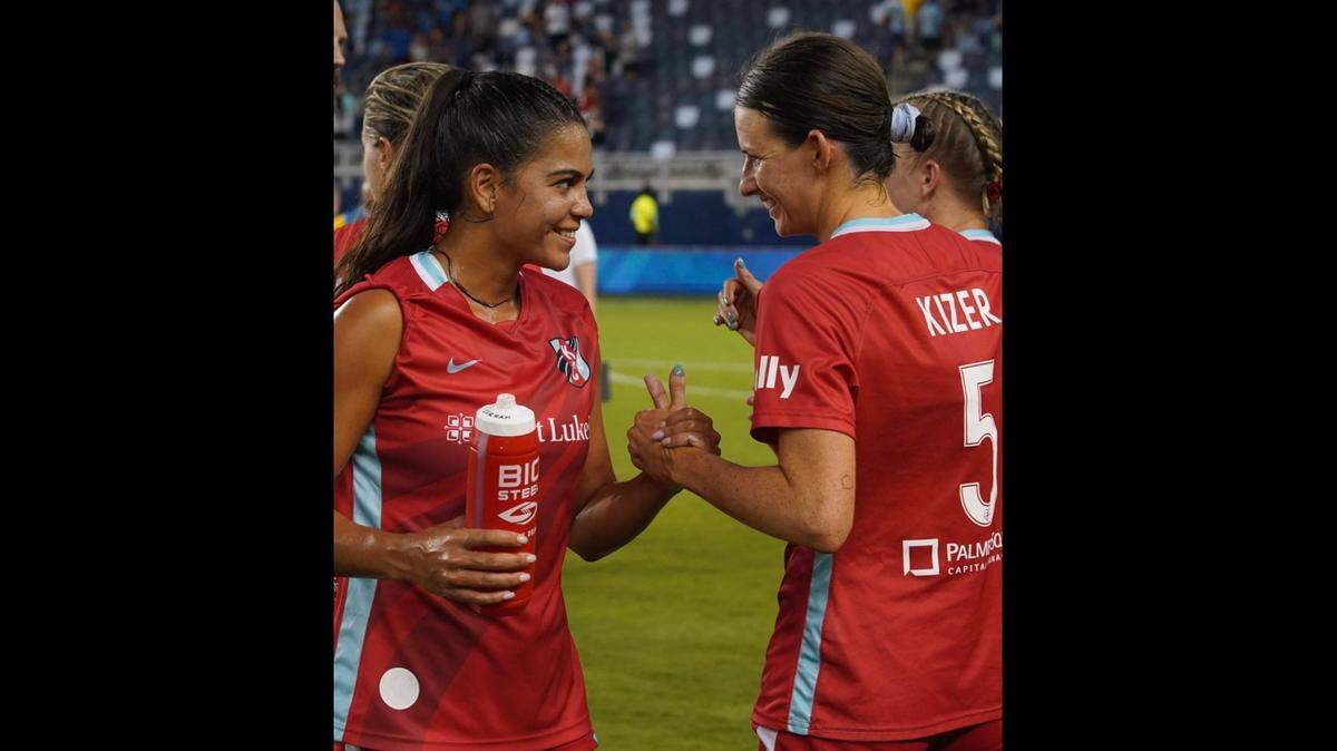 Chardonnay Curran, left, and Cece Kizer share congratulations after the Kansas City Current beat the North Carolina Courage 3-2 on Sunday at Children’s Mercy Park in Kansas City, Kan.