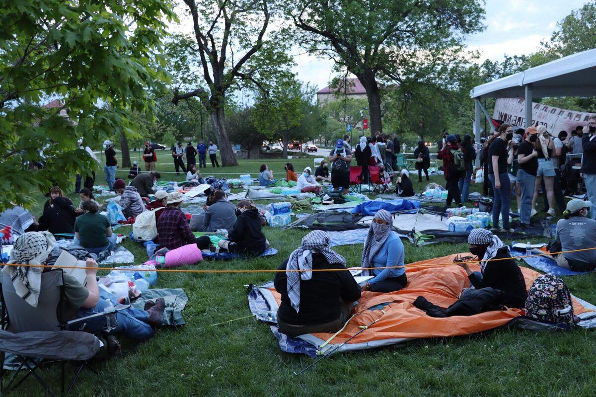 Students for Justice in Palestine and other student activists at a protest encampment in front of Fraser Hall at the University of Kansas in May 2024.