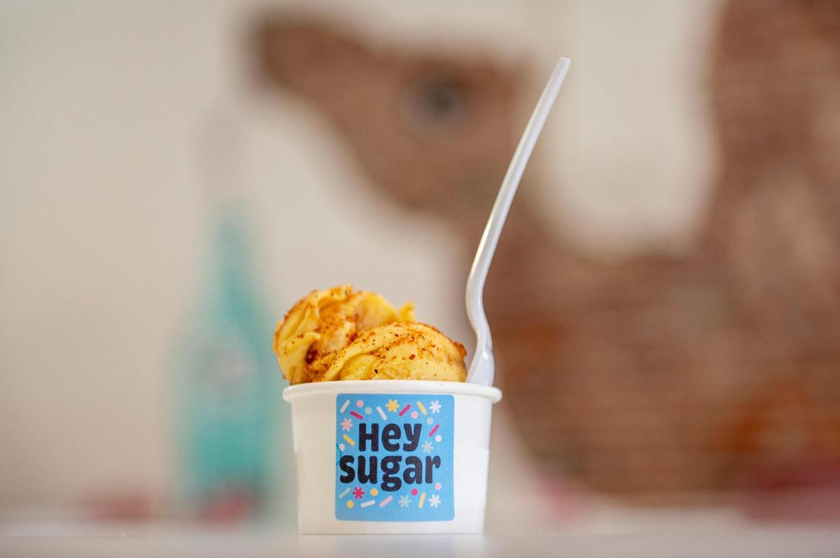 A scoop of Mangonada ice cream, sprinkled with Tajín. 