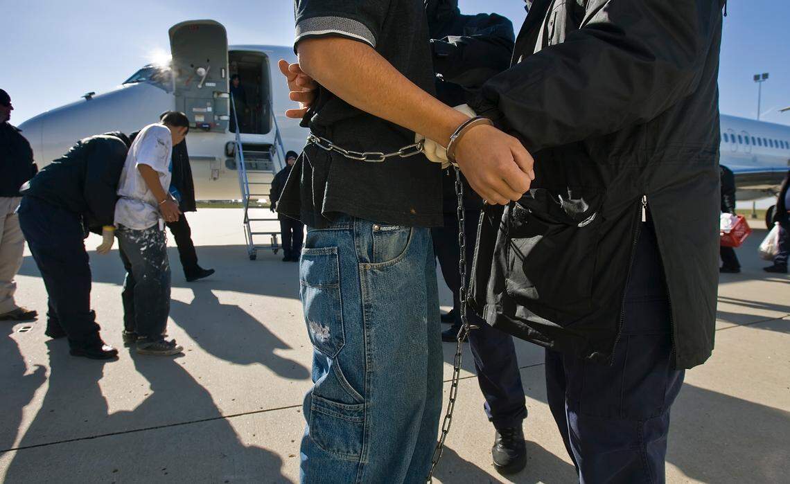 Undocumented immigrants, shackled at the wrists and ankles, were searched before boarding a charter flight at Kansas City International Airport, run by the Immigration and Customs Enforcement (ICE) Department. The detainees were flown to Louisiana, Texas or Arizona, where they are returned to or flown to the detainees countries of origin.