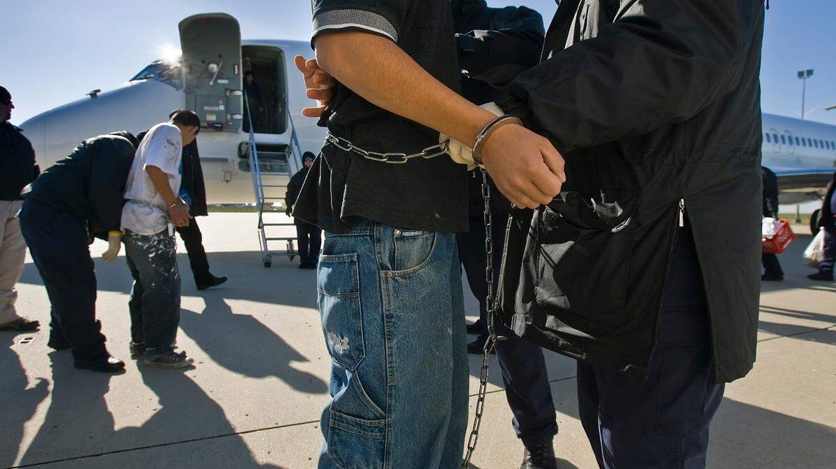 Immigrants who lack the proper documents, shackled at the wrists and ankles, were searched before boarding a charter flight at Kansas City International Airport, run by the Immigration and Customs Enforcement (ICE) Department. The detainees were flown to Louisiana, Texas or Arizona, where they are returned to or flown to the detainees countries of origin.