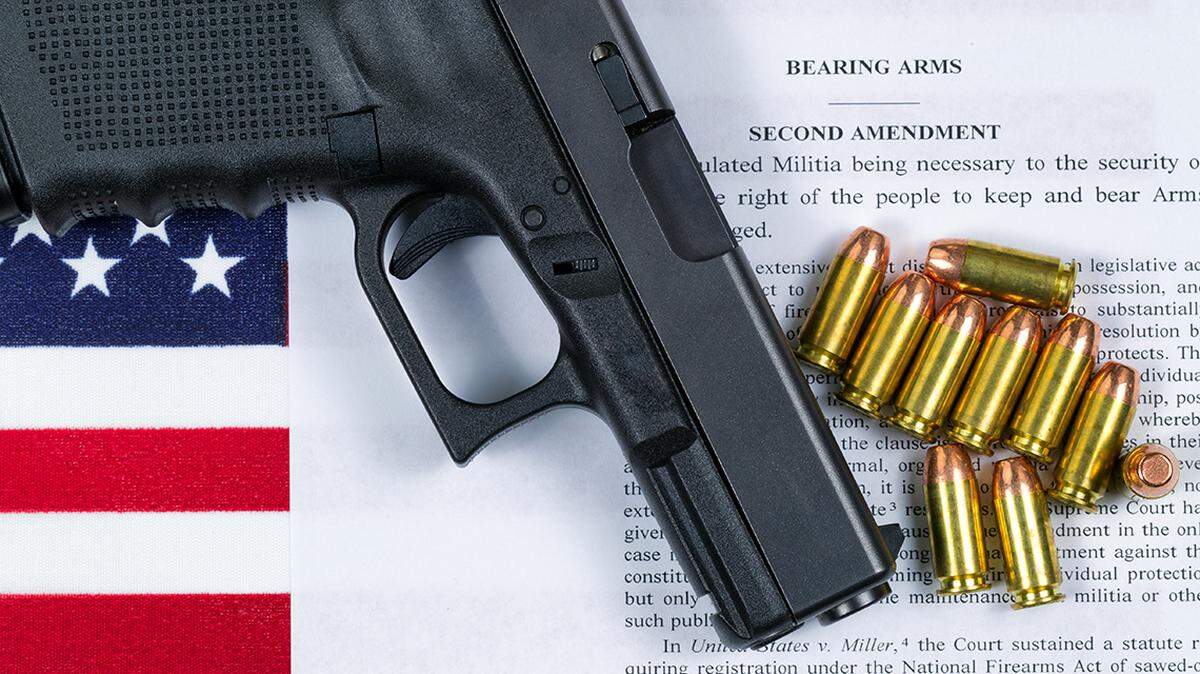 Pistol bullets USA flag and Text of second amendment for the right to bear arms. gun firearm constitution 