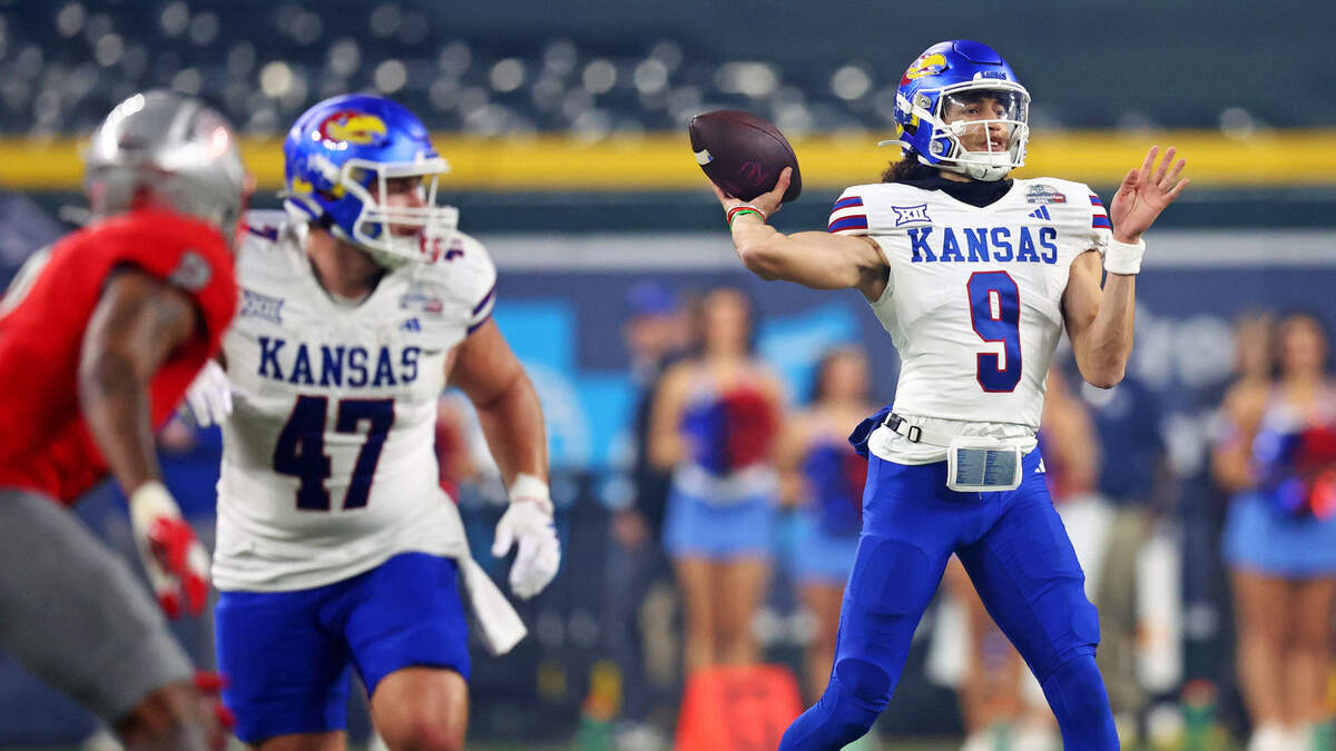 Kansas Jayhawks quarterback Jason Bean (9) throws a pass during the first quarter against the UNLV Rebels in the Guaranteed Rate Bowl at Chase Field in Phoenix on Dec. 26, 2023.