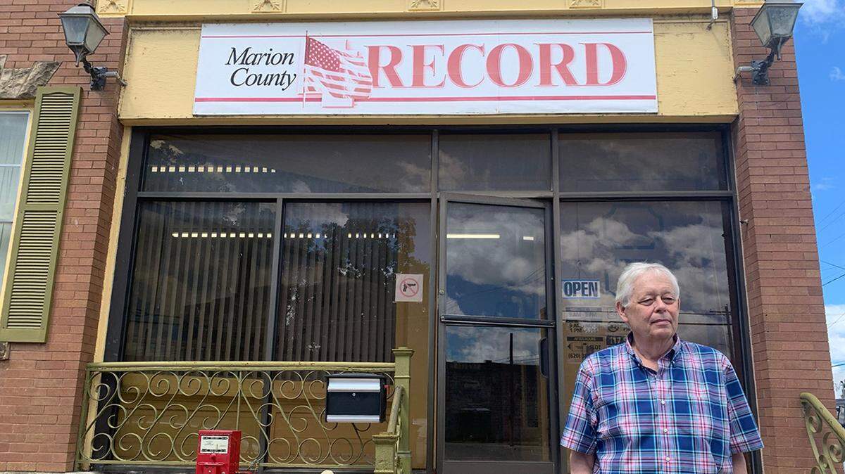 Eric Meyer, the editor and publisher of the Marion County Record, stands outside the newspaper's office after police raided both the office and his home in 2023
