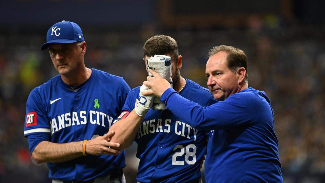 Kansas City Royals center fielder Kyle Isbel (28) walks off the field after getting hit in the face by a foul tip in the seventh inning against the Tampa Bay Rays at Tropicana Field on May 25, 2024.