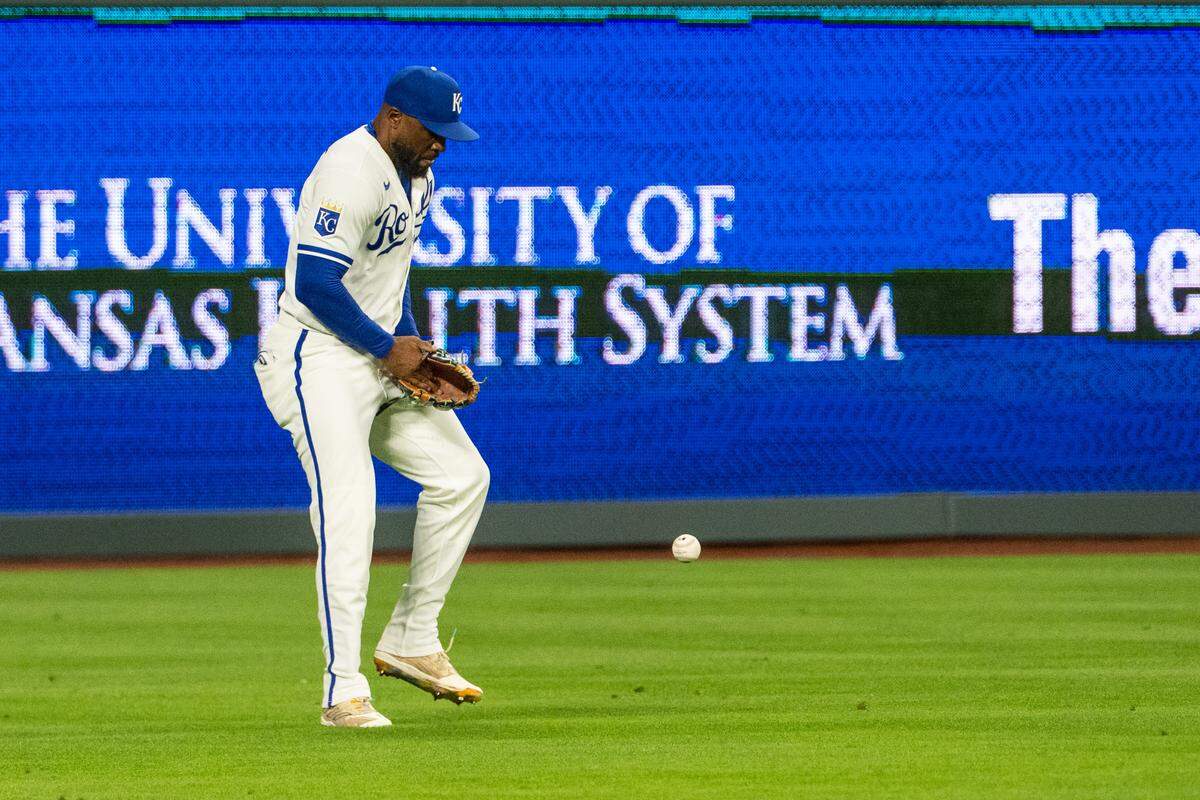 Kansas City Royals right fielder Starling Marte tries to corral the ball during the ninth inning of a game against the Boston Red Sox on Tuesday, May 19, 2026, at Kauffman Stadium.