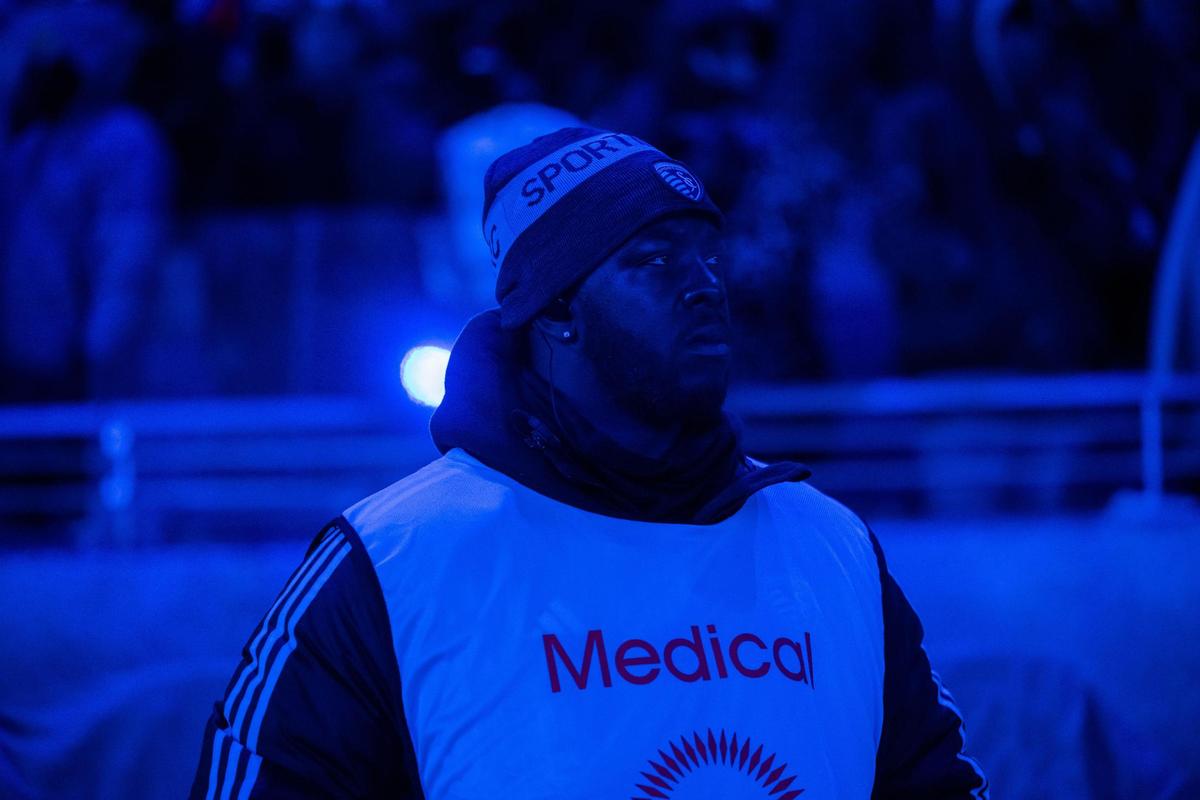 A medical staff member stands in the cold before the start of the Concacaf Champions Cup match of Sporting KC vs. Inter Miami CF on Wednesday, Feb. 19, 2025, at Sporting Park. The temperatures were in the single digits for the game that Sporting KC lost to Miami 0-1.