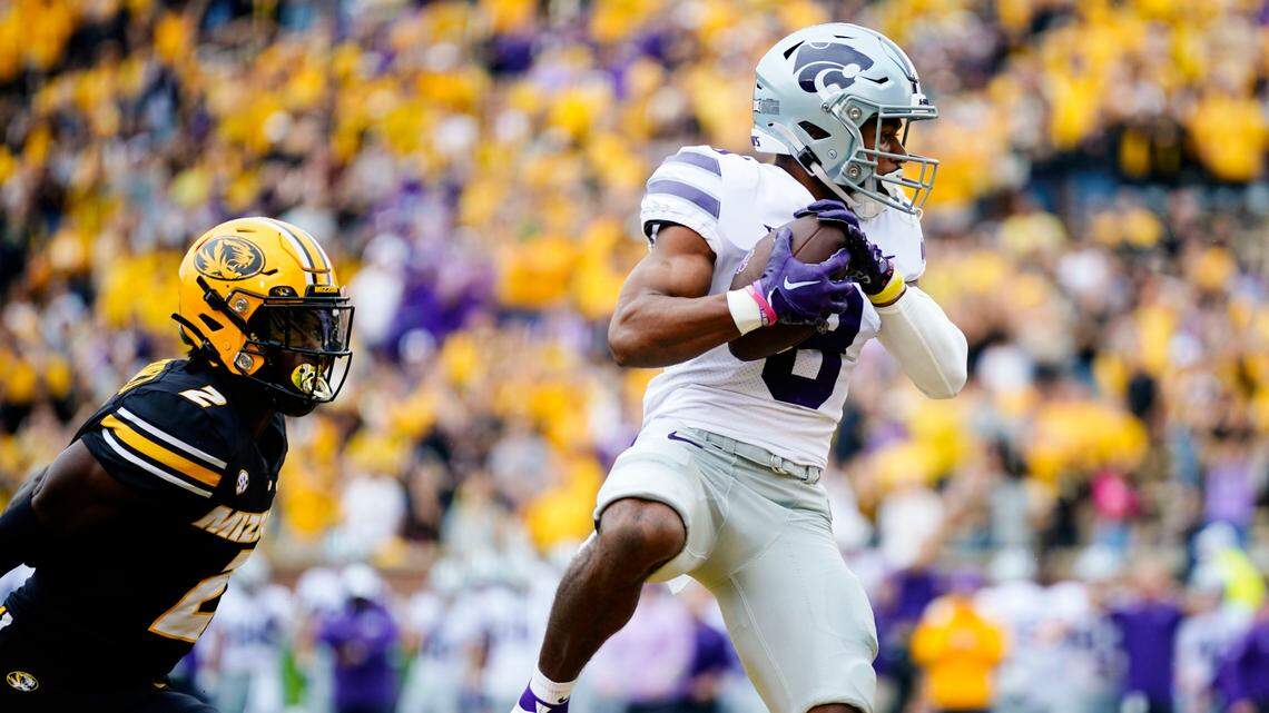 Kansas State Wildcats wide receiver Phillip Brooks (No. 8) catches a touchdown pass in front of Missouri Tigers defensive back Ennis Rakestraw Jr. during Saturday’s game at Faurot Field in Columbia.