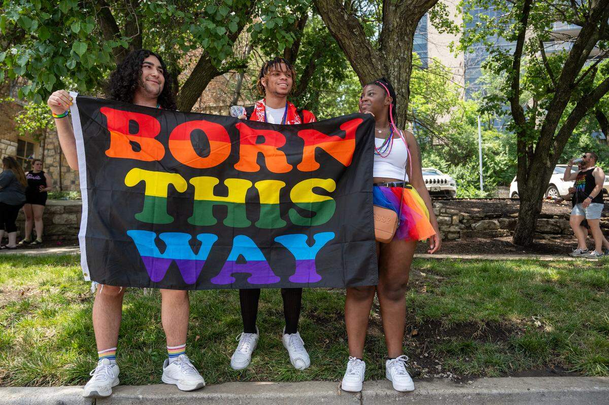 Three young people showed their pride during the KC Pride Parade on Saturday, June 8, 2024, in Kansas City.