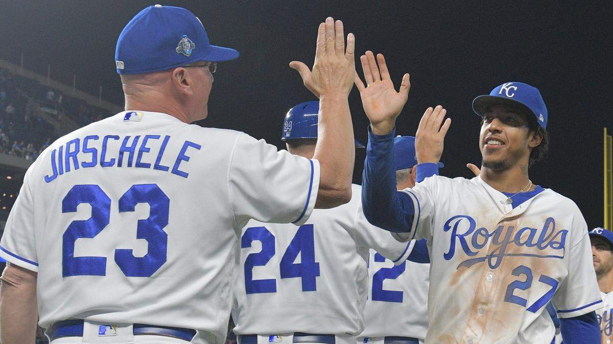 Kansas City Royals shortstop Adalberto Mondesi (27) is congratulated by third base coach Mike Jirschele (23) after the win over the Cleveland Indians the Cleveland Indians at Kauffman Stadium on Sept. 29, 2018.