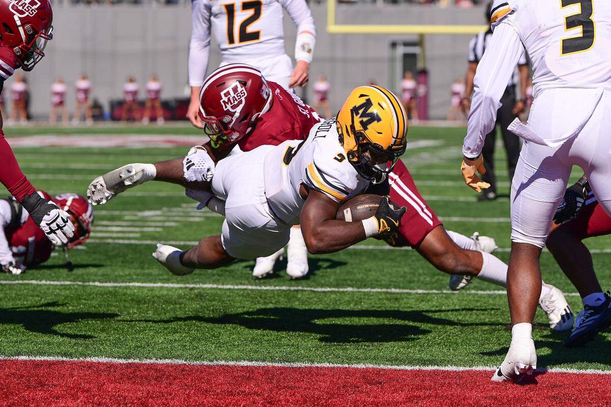 Missouri Tigers running back Marcus Carroll dives in for one of his three rushing touchdowns on Saturday against the Massachusetts Minutemen at Warren McGuirk Alumni Stadium in Amherst, Mass.