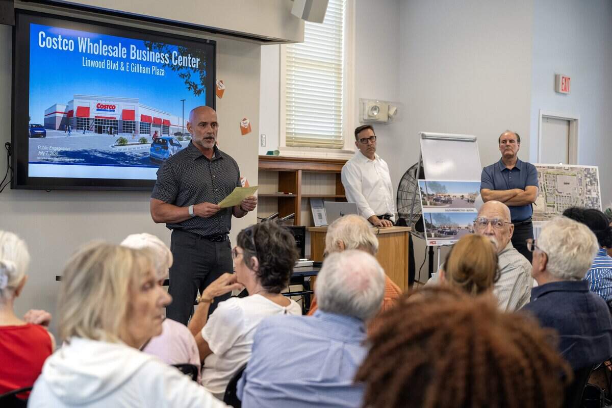 Steven Chamberlain, general manager at Costco Wholesale, speaks during a public meeting about the proposed Costco Linwood Business Center zoning changes at the Westport Library on Tuesday, July 7, 2026, in Kansas City.