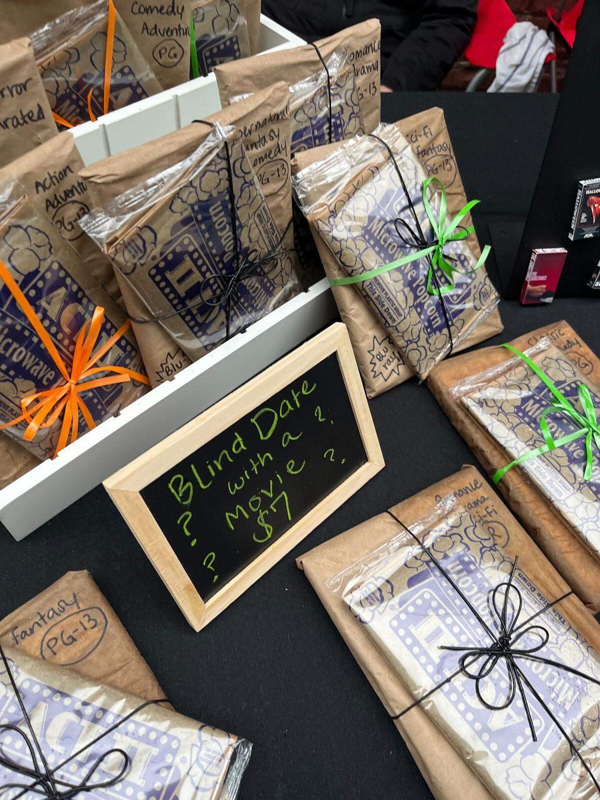 A vendor at Art Garden KC during First Friday in April sold $7 mystery movies with popcorn.